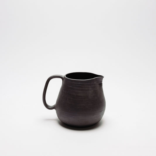 obsidian black clay pitcher